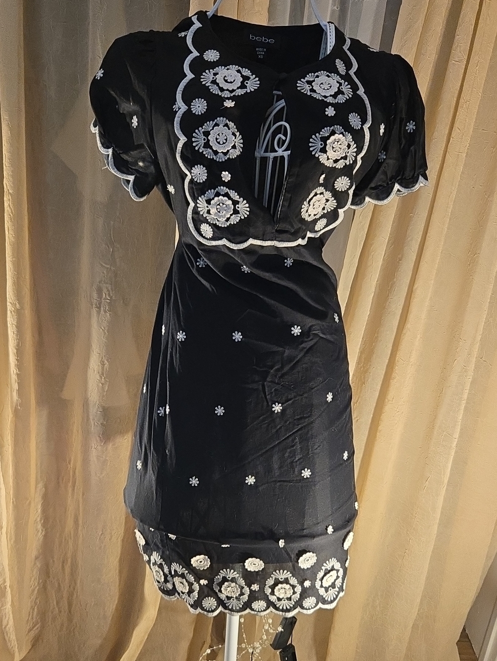 bebe Black Linen Mini Dress with white floral embroidery, XS.